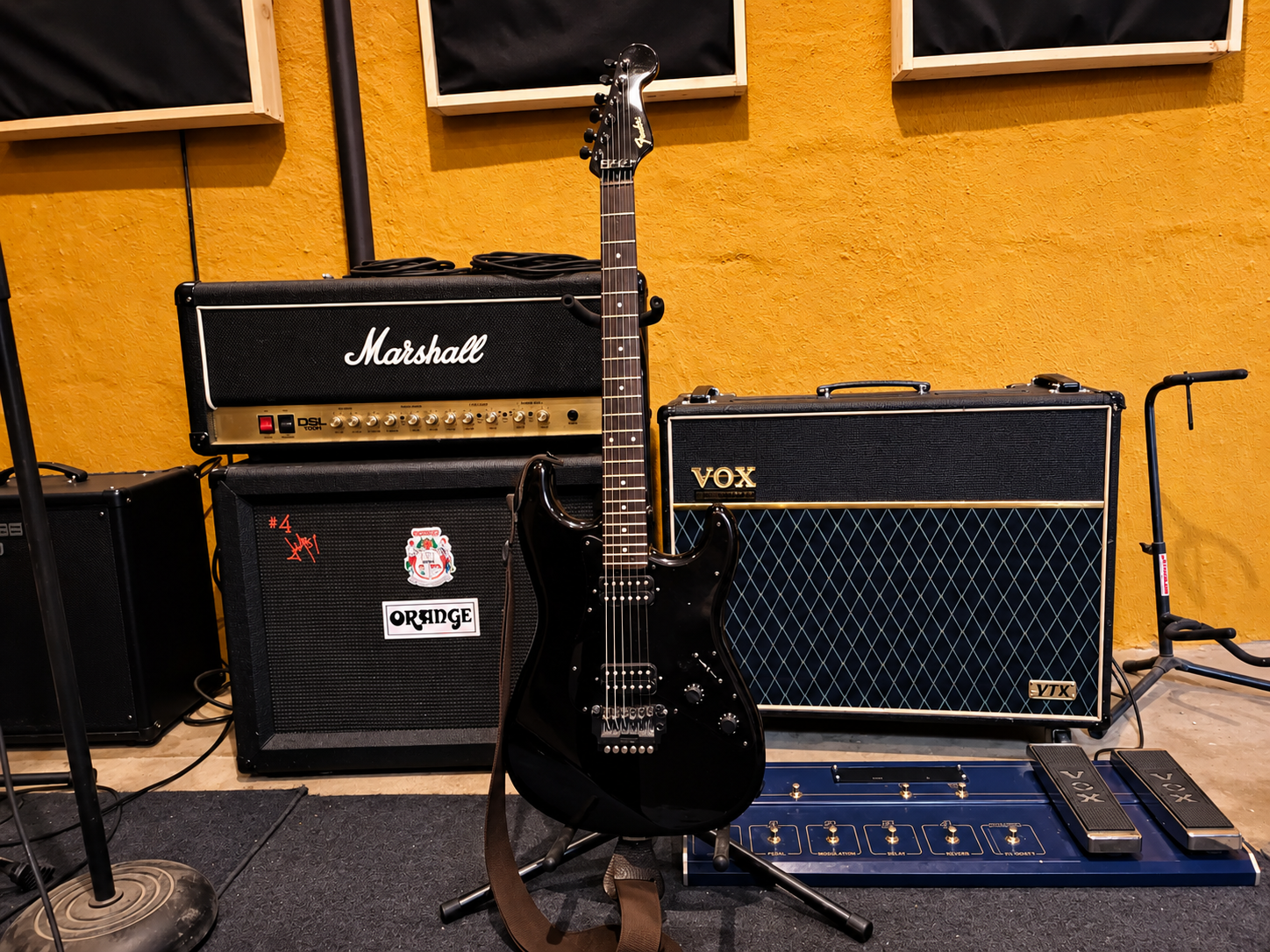 Black-Fender-Guitar-in-a-Cozy-Studio