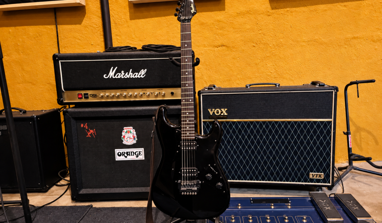 Black-Fender-Guitar-in-a-Cozy-Studio